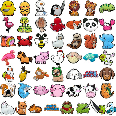 Collection of various animal and character shoe charms on a white background
