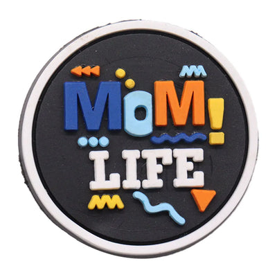 Round charm with colorful text 'Mom! Life' on a black background