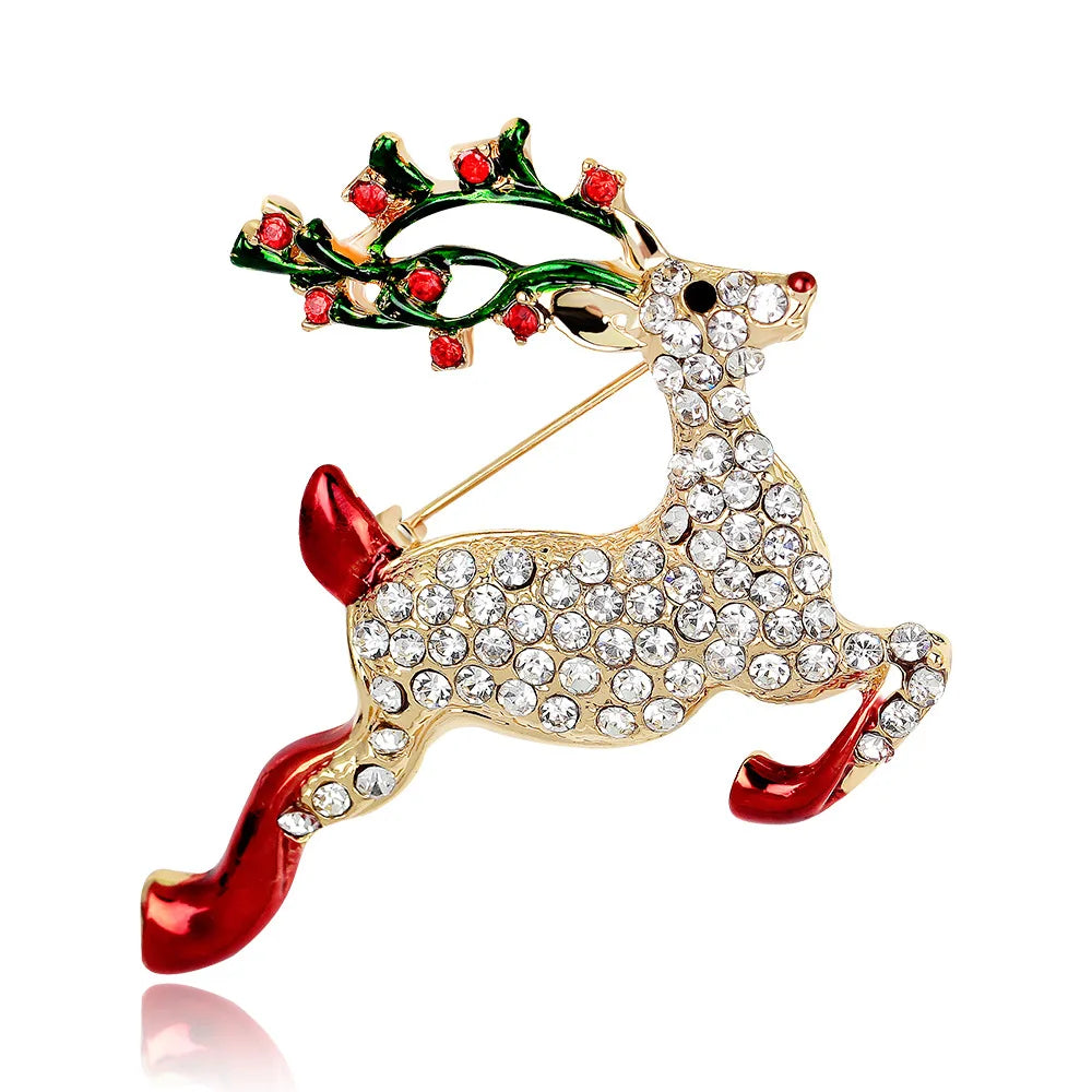 Decorative reindeer brooch with red and green accents on a white background