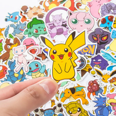 Collection of colorful cartoon stickers featuring various characters, with a hand holding one of them.