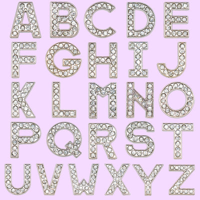 shoe charms Decorative metallic letters on a pink background
