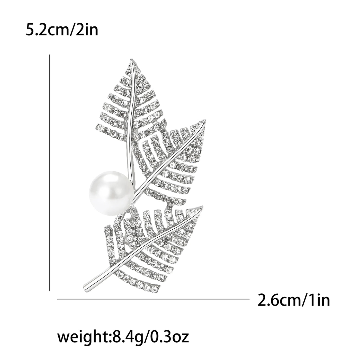 Silver leaf brooch with pearl center and measurements on a white background