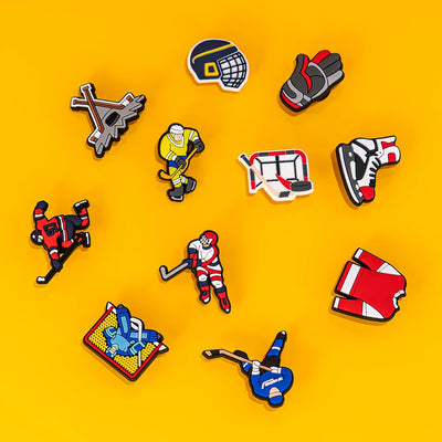 Collection of hockey-themed charms on a yellow background