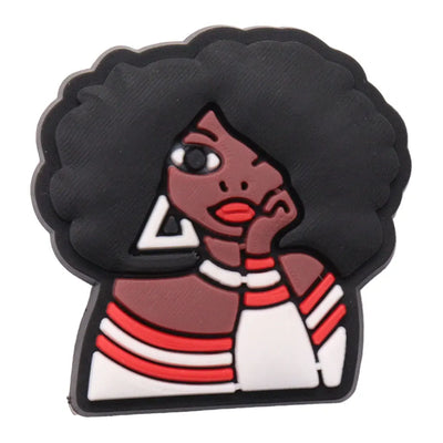 Charm with a stylized character wearing a striped sweater on a white background