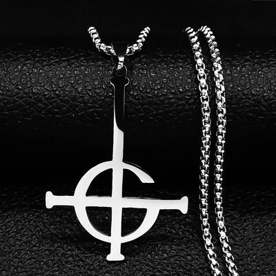 Silver pendant with chain on a textured black surface