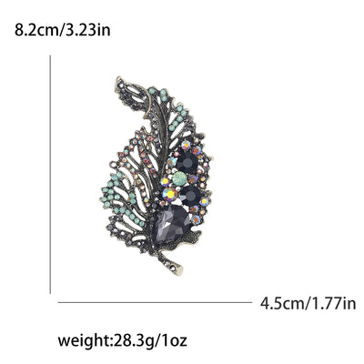 Decorative brooch with gemstones and measurements on a white background
