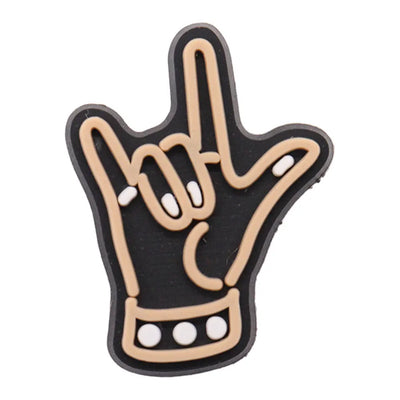 Hand-shaped charm with a black outline and beige interior on a white background