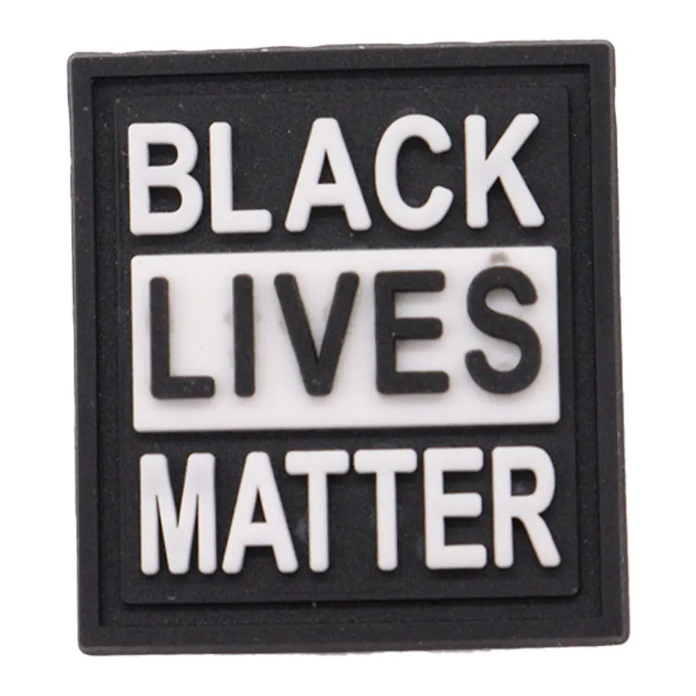 charm of a Black Lives Matter sign with white text on a black background