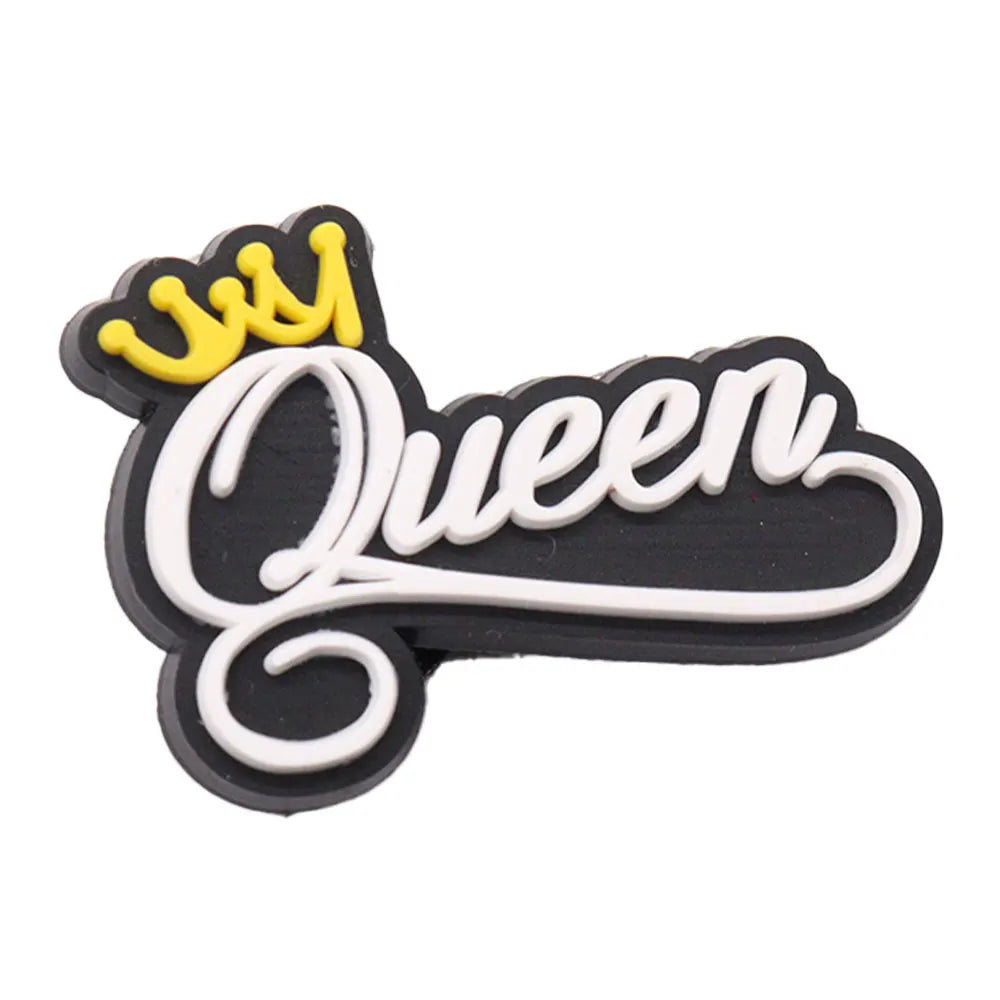 charm with 'Queen' text and yellow crown on black background