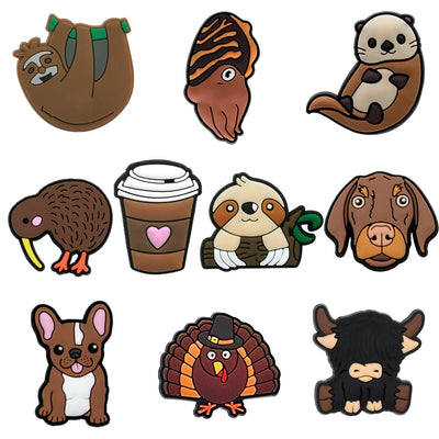 Collection of cartoon animal shoe charms on a white background