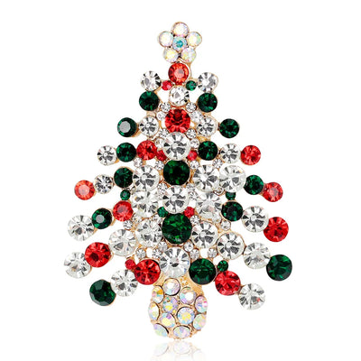 Christmas tree-shaped brooch with red, green, and clear gemstones on a white background