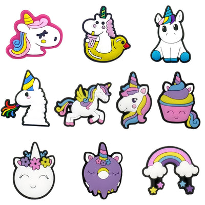Collection of colorful unicorn-themed shoe charms on a white background