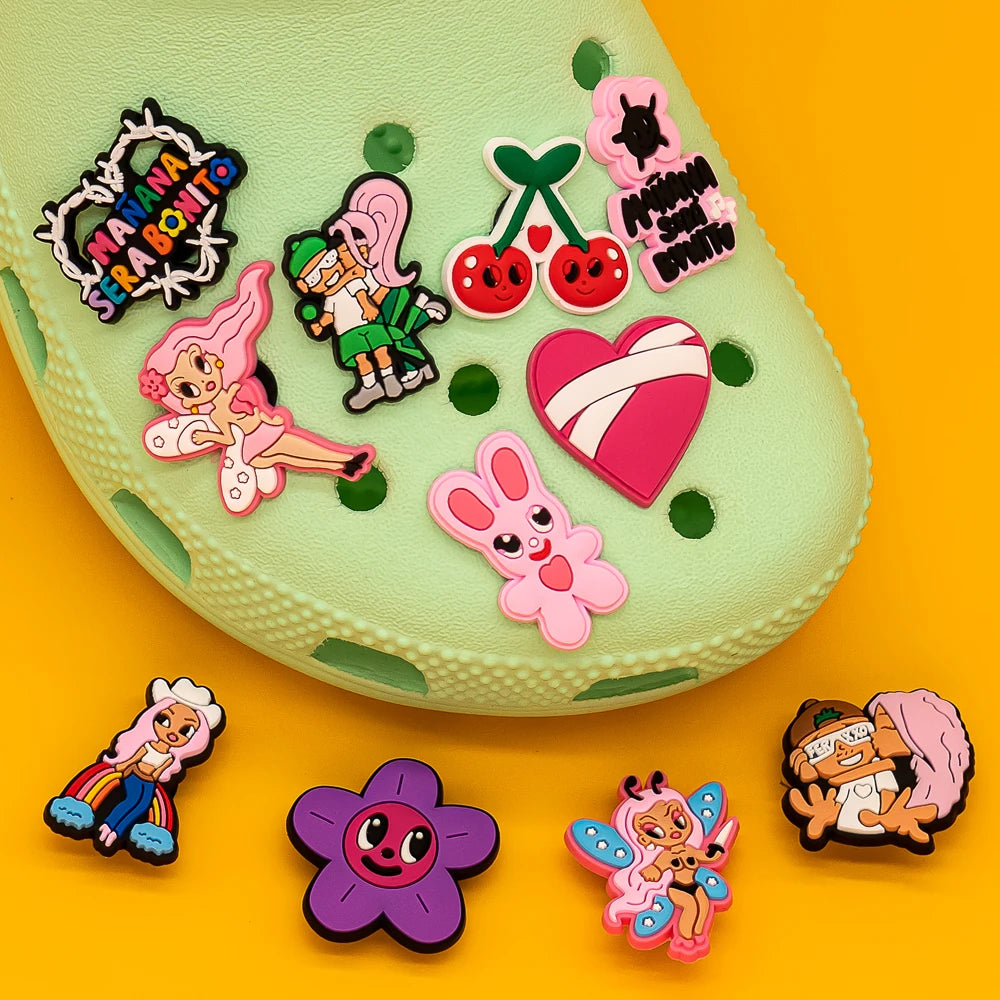 Colorful shoe charms on a green shoe with a yellow background