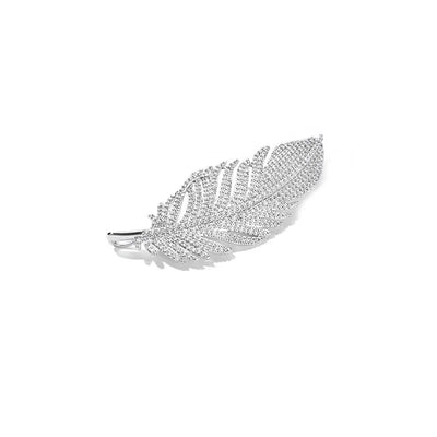 Silver feather-shaped brooch with gemstones on a white background