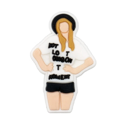 shoe charm of a person wearing a white shirt with text on a white background