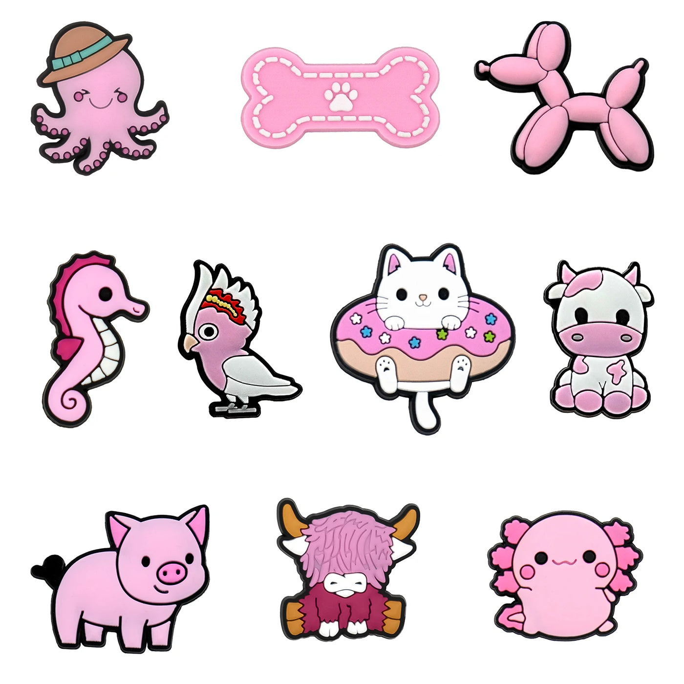 Collection of cute pink animal and object shoe charms on a white background