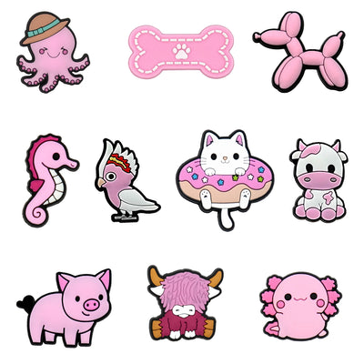 Collection of cute pink animal and object shoe charms on a white background