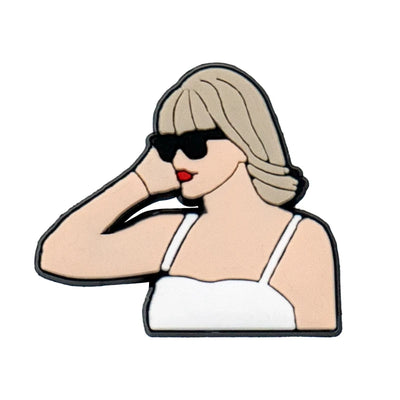 shoe charm of a woman wearing sunglasses and a white top on a white background
