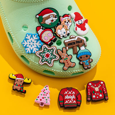 Green shoe with Christmas-themed charms on a yellow background