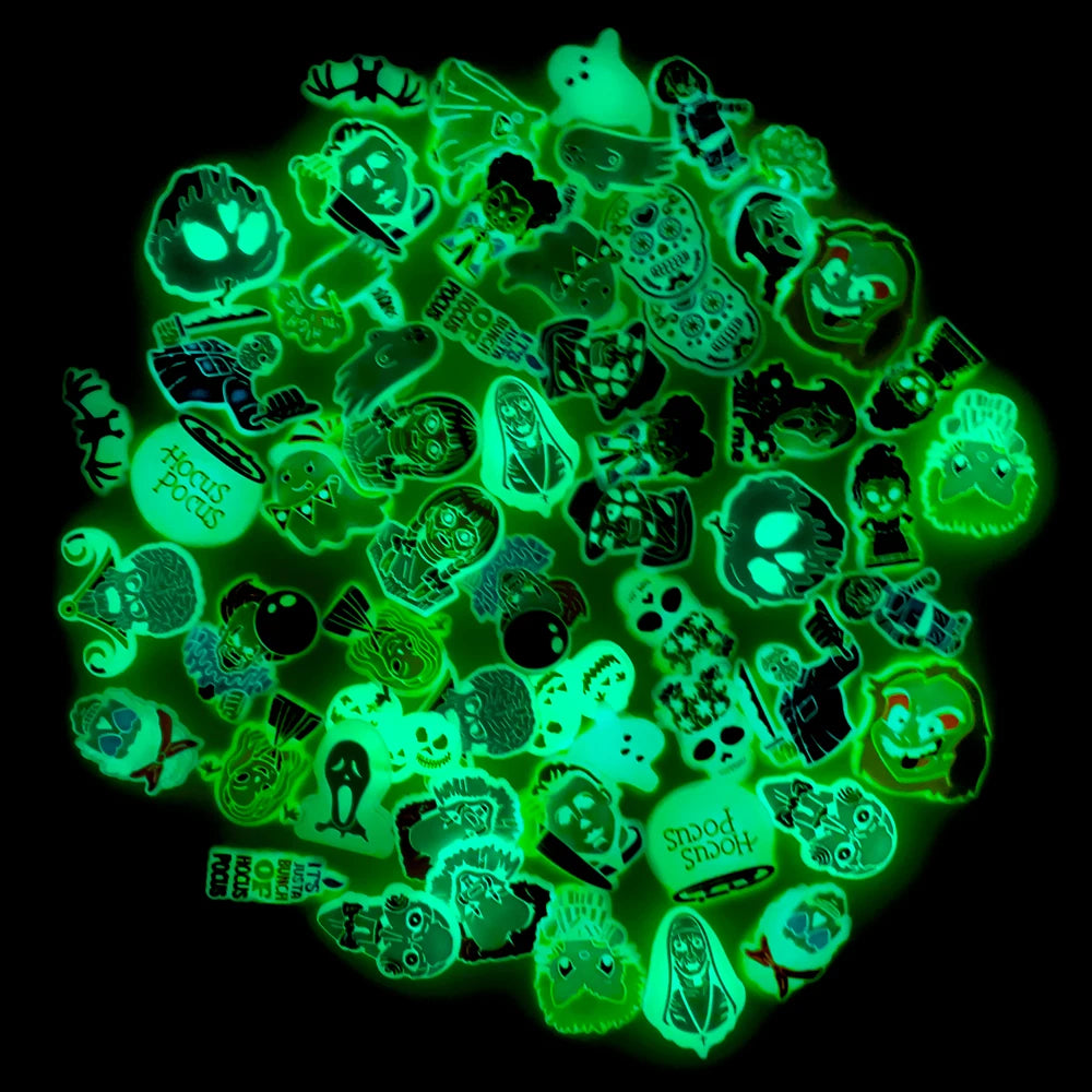 Assorted green glow-in-the-dark shoe charms on a black background