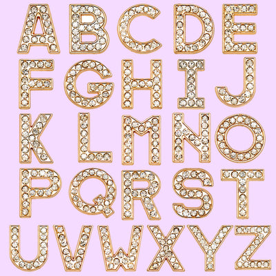 shoe charms Gold letters A to Z on a pink background