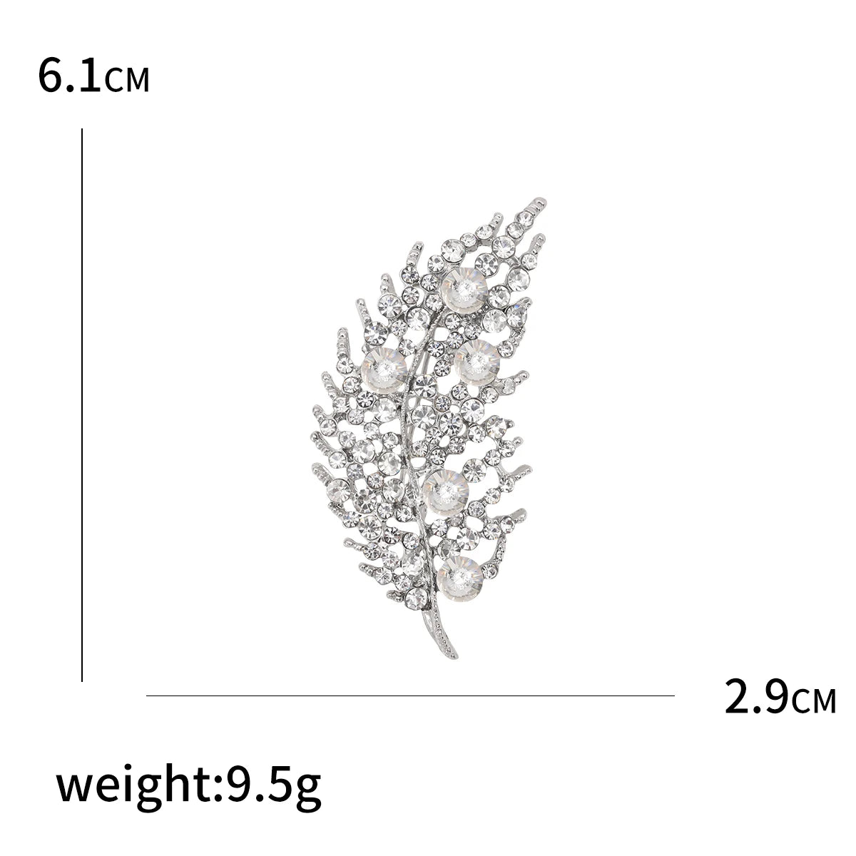 Decorative brooch with measurements and weight on a white background