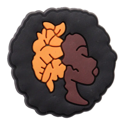 charm of a girl head and black hair with an orange hair pin on a white background