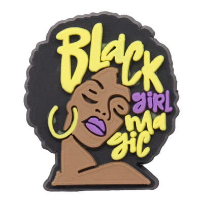 Charm with 'Black Girl Magic' text and a stylized face on a black background