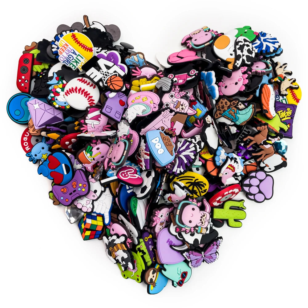 Collection of colorful shoe charms shaped like cartoon characters on a white background