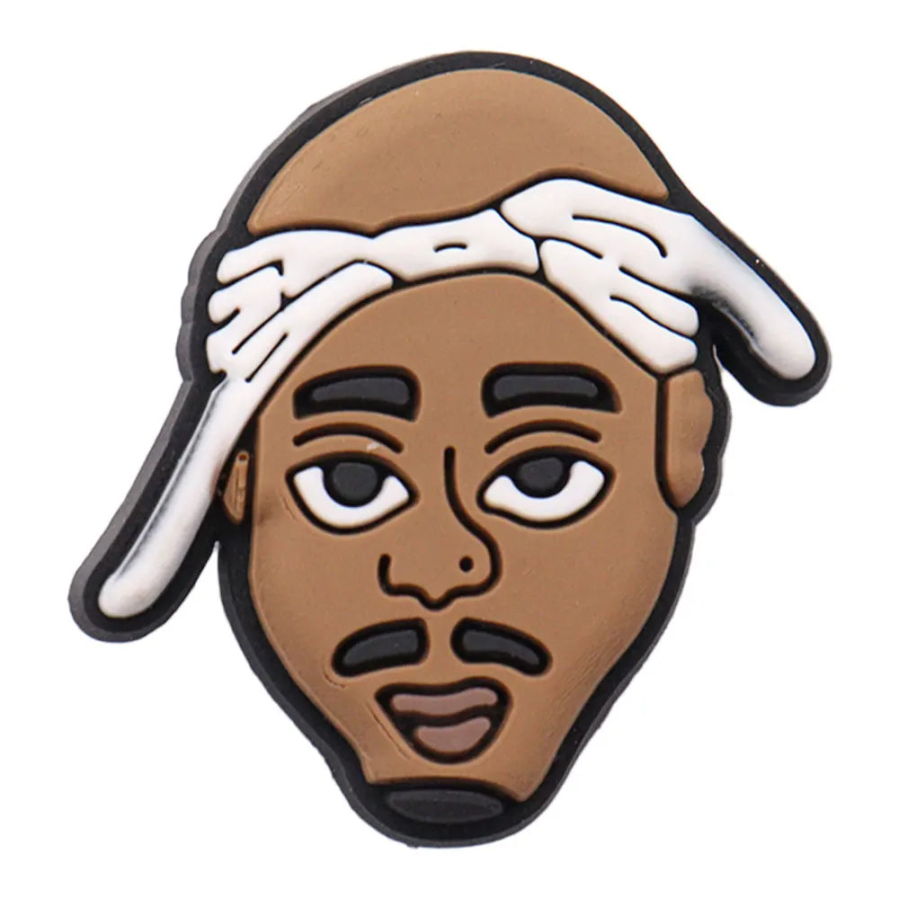 Charm of a stylized face wearing a cap and headband on a white background