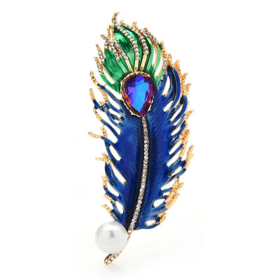 Colorful feather-shaped brooch with gemstones and a pearl on a white background