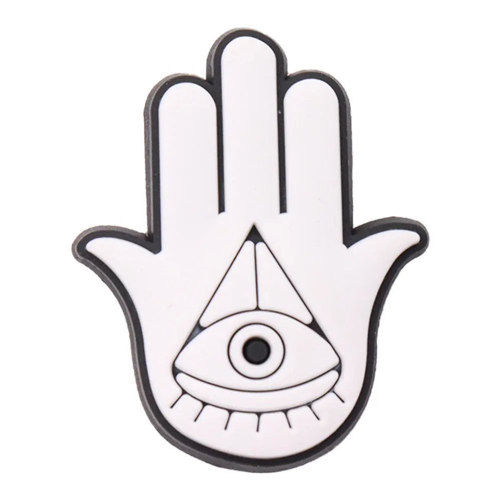 charm of Hamsa hand with an eye symbol on a white background