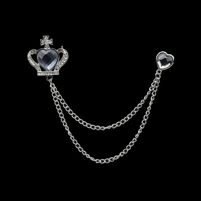 Jewelry piece with heart-shaped elements and a chain on a black background