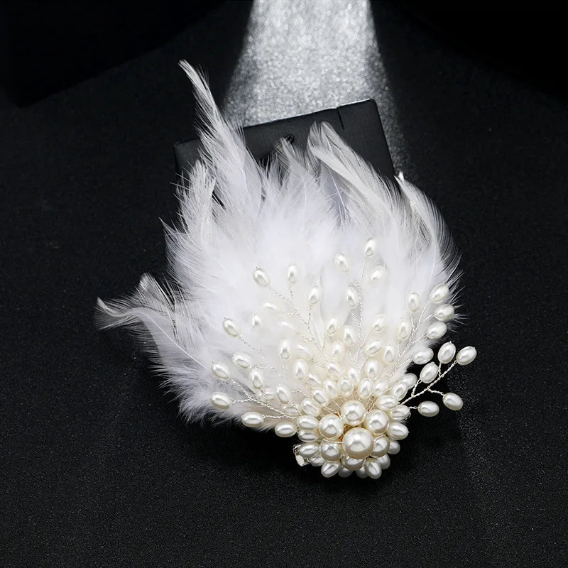 White feather and pearl hair clip on a black background