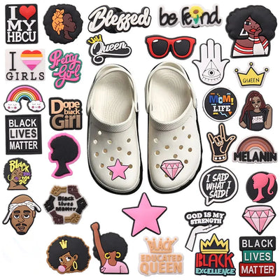 White crocs with various colorful charms on a white background