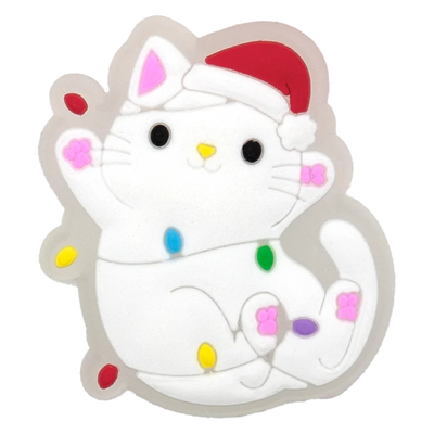 Cartoon cat with colorful spots and a red hat on a white background