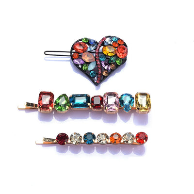 Colorful gemstone hair pins on a white background