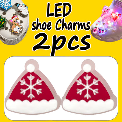 LED shoe charms with snowflake design on a yellow background