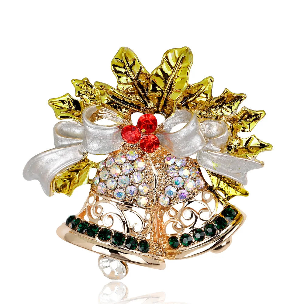 Decorative brooch with gold leaves, red and green gemstones on a white background