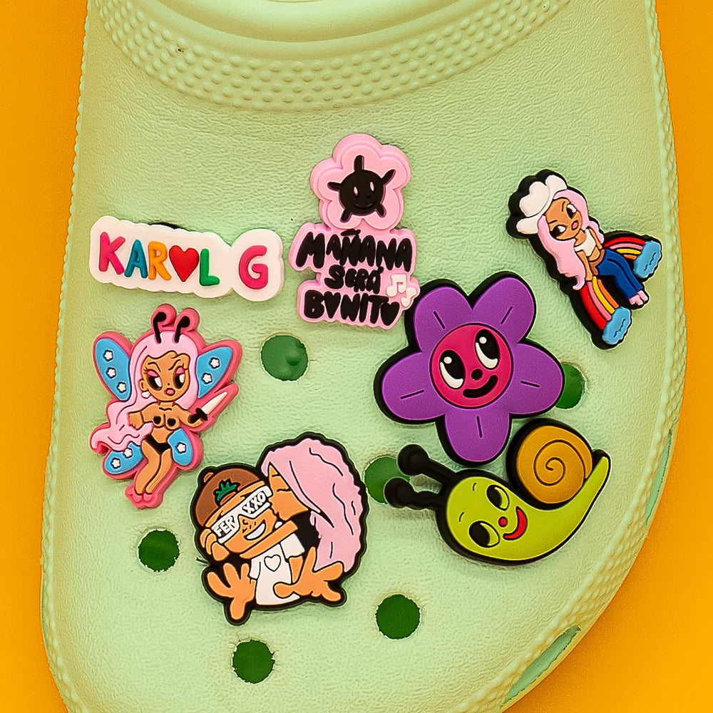 Collection of colorful cartoon character shoe charms on a yellow background