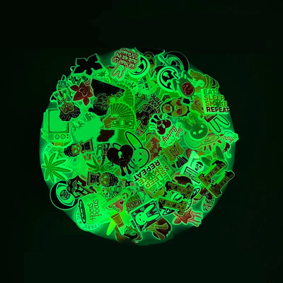 Collection of green glow-in-the-dark shoe charms on a black background