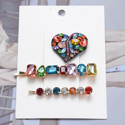 Colorful gemstone hair barrette on a white card with a blurred background