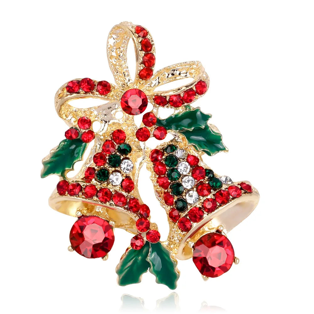 Decorative brooch with red and green gemstones on a white background