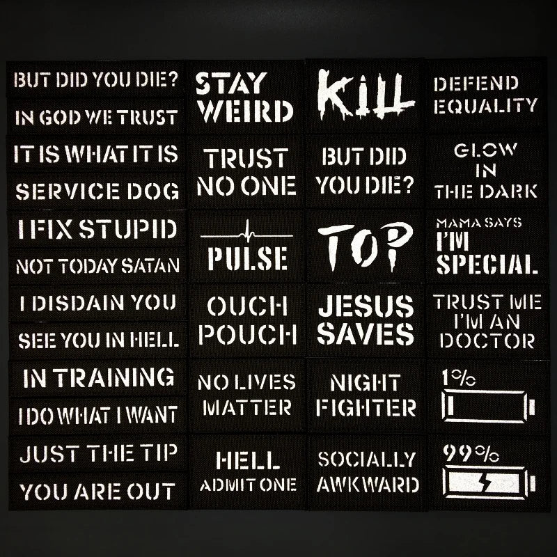 Collection of black stickers with white text on a dark background