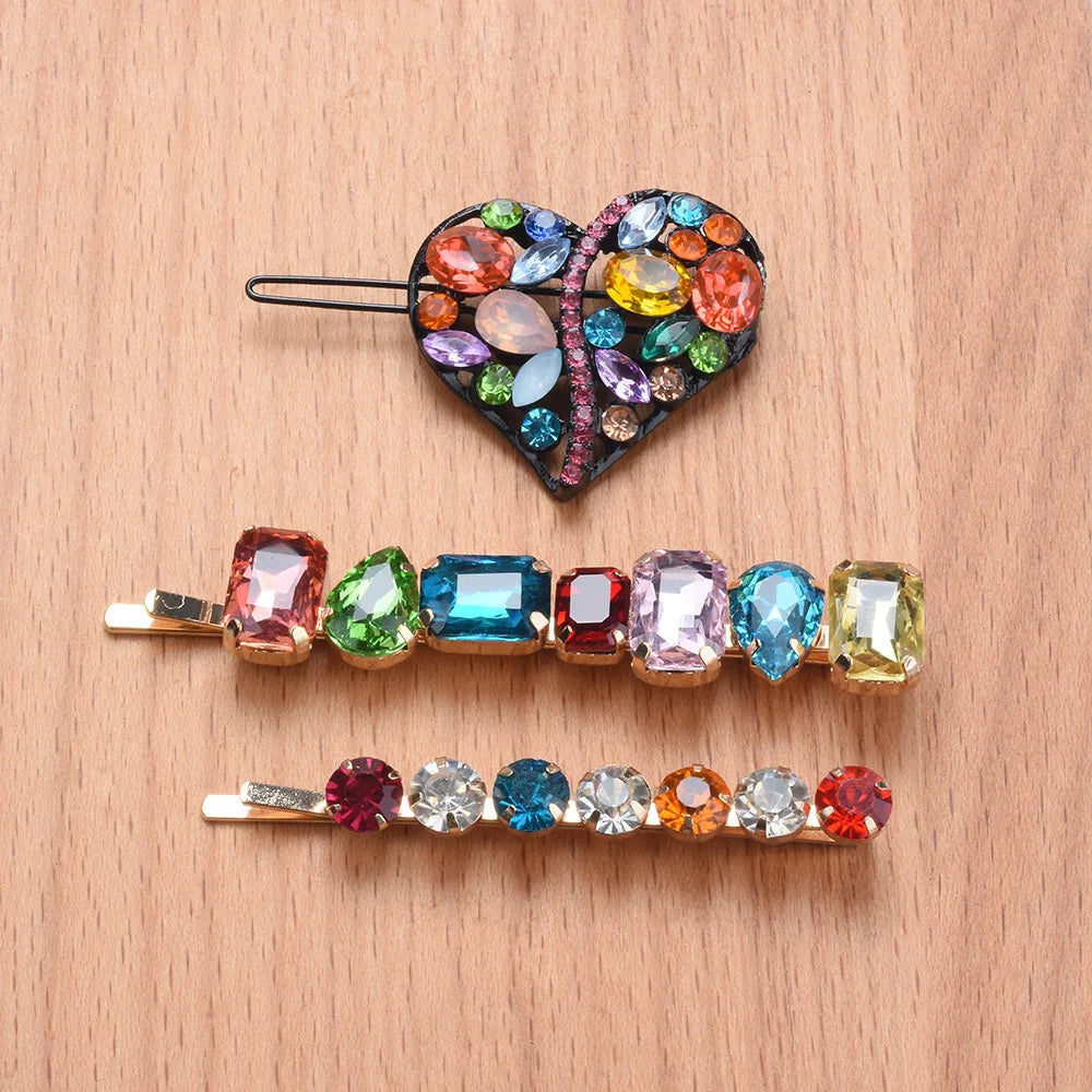 front view of a colorful gemstone hair clips on a wooden surface
