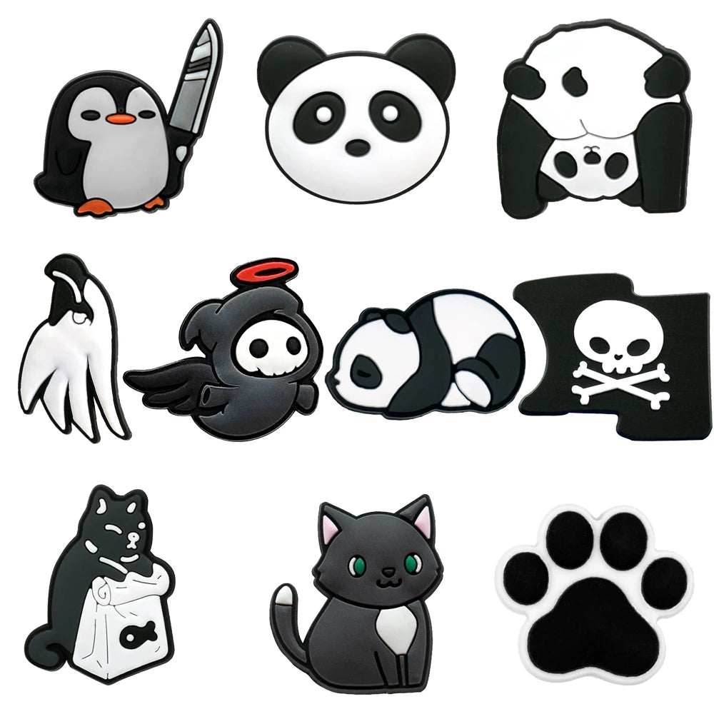 Collection of black and white animal-themed shoe charms on a white background