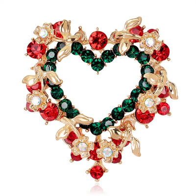Decorative wreath ornament with red and green gemstones on a white background