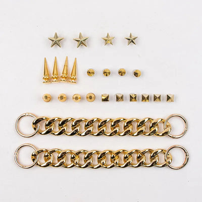 Collection of gold Rivet Shoe Charms  including chains, spikes, and star-shaped charms a white background