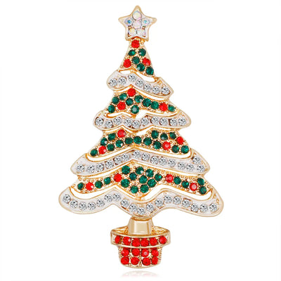 Christmas tree-shaped brooch with red, green, and clear gemstones on a white background