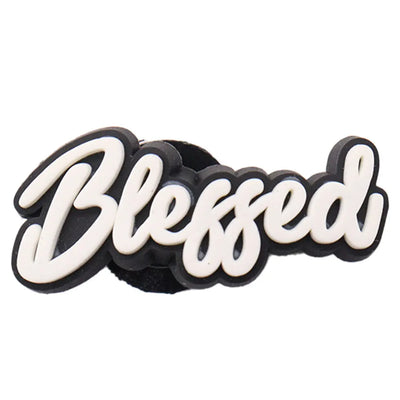 Black and white 'Blessed' charm on a white background